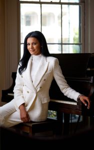 Woman Posing By Piano